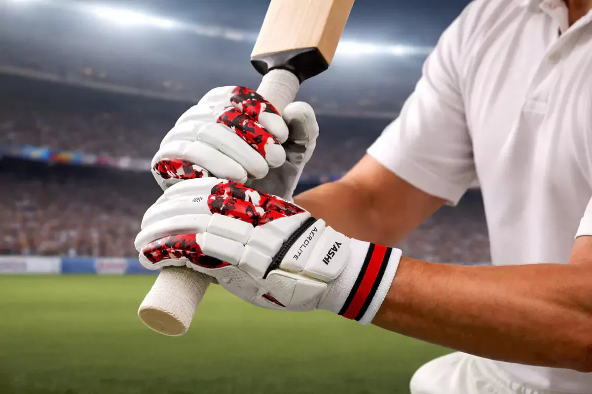 Cricket player wearing Yashi batting gloves gripping a bat, showcasing superior comfort, grip, and safety